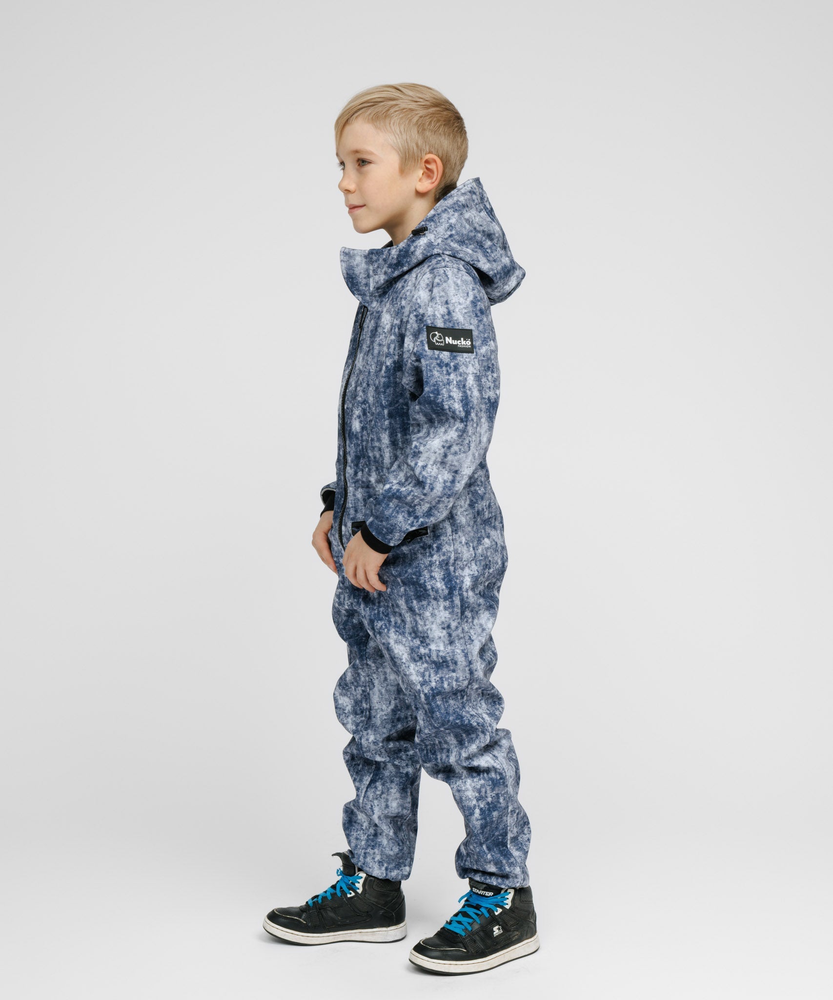 Child in a softshell outer layer for a Nordic winter
