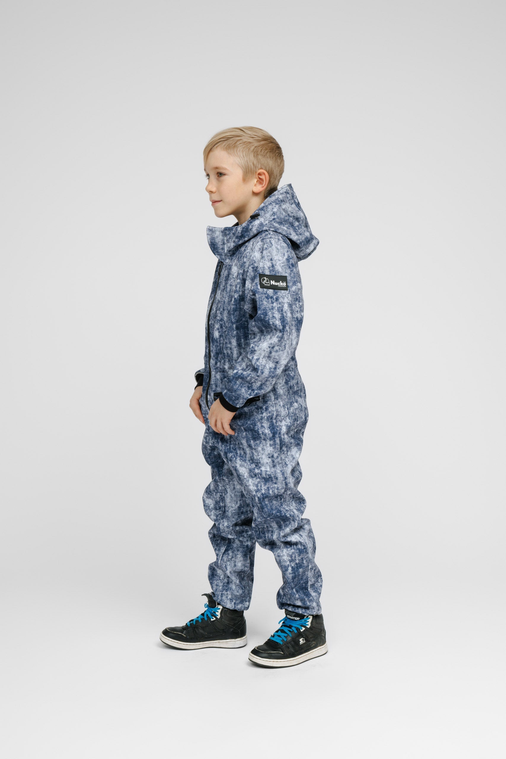 Child in a softshell outer layer for a Nordic winter