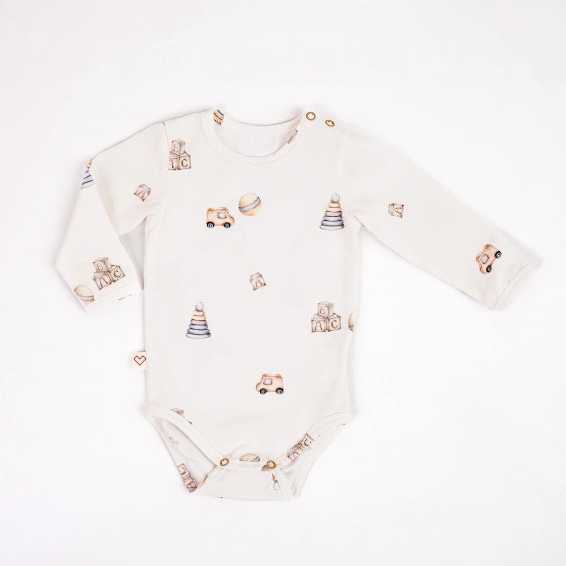 Organic cotton long sleeved baby bodysuit with a toy print by Karloova