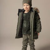 Boy in a khaki double layer merino wool beanie by Lenne