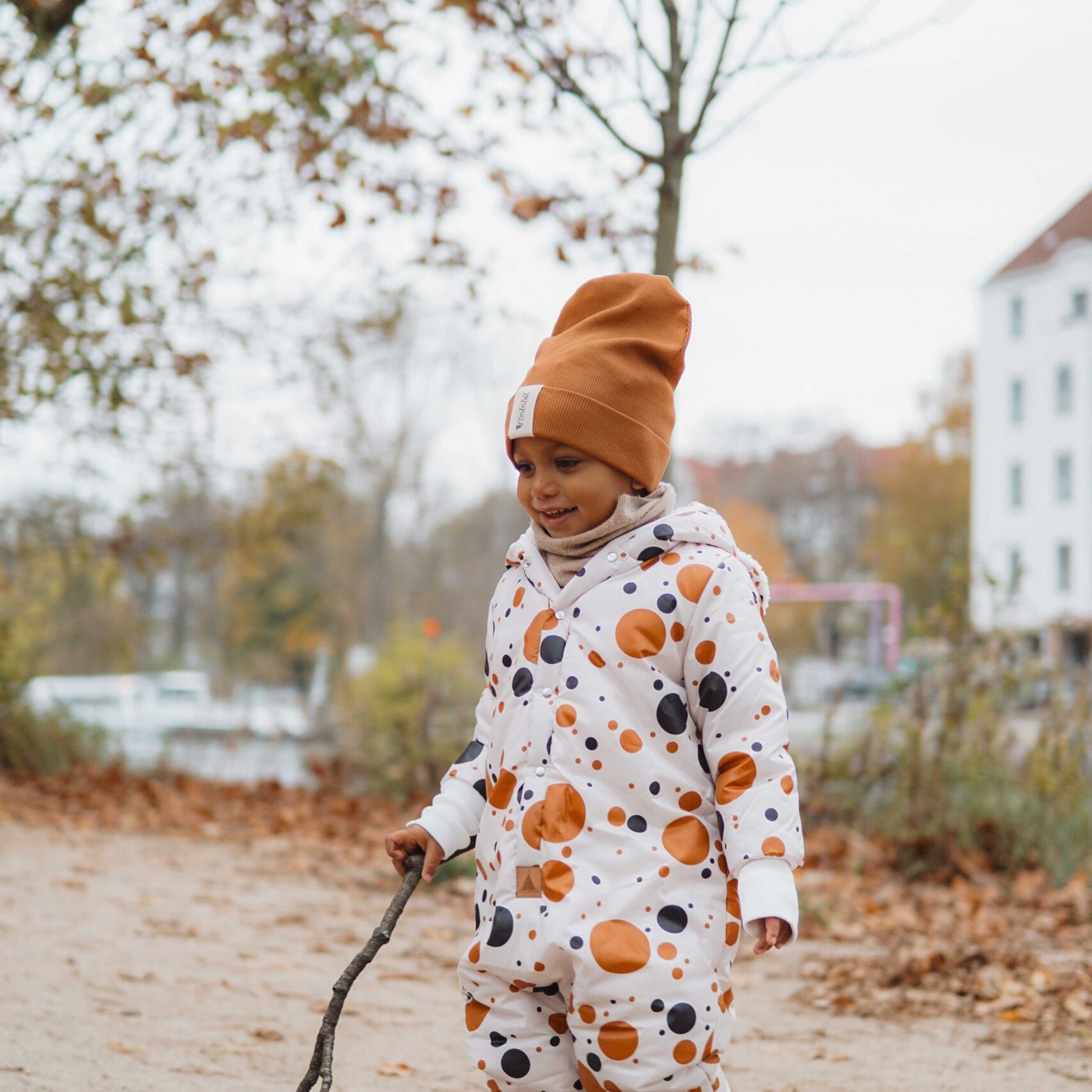 Winter Jumpsuit with Teddy Lining for Babies and Kids - Black and Orange Dots