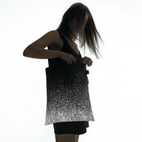 SPLASH reflective tote bag with a space print by MARCH Design Studio, studio view