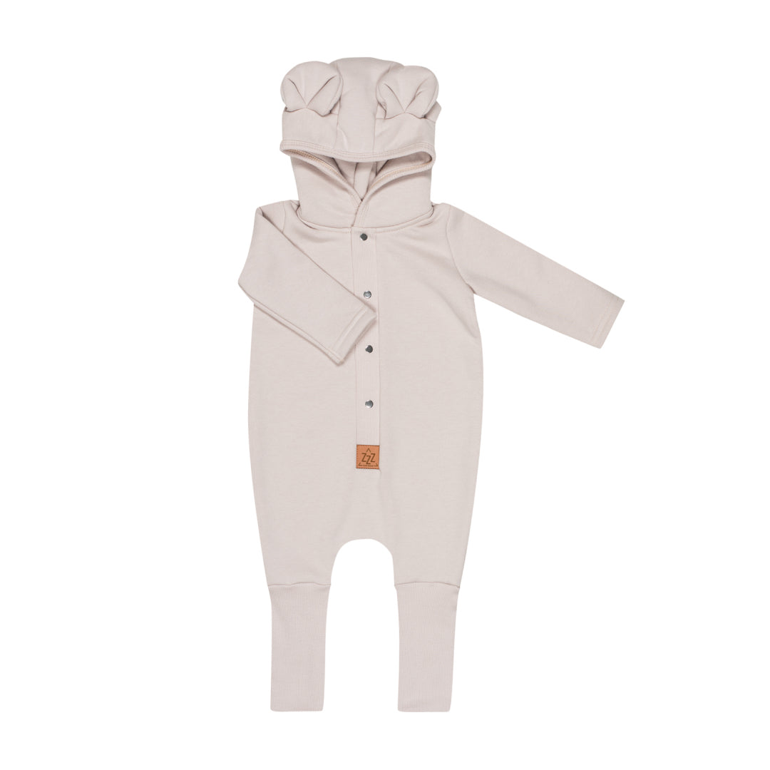 Pale sand hooded baby romper, shown flat with the eared hood and press studs